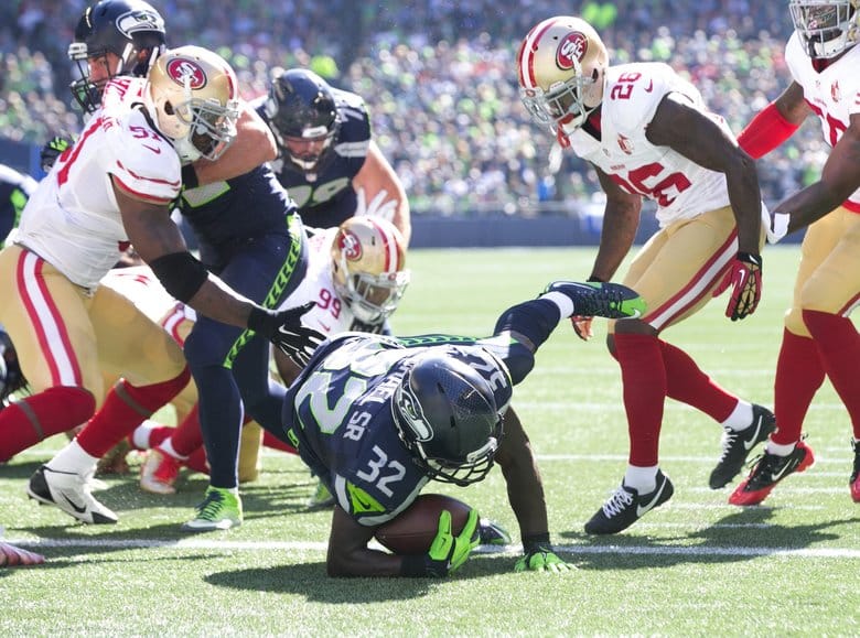 Seattle running back Christine Michael plunges into the end zone against the San Francisco 49ers