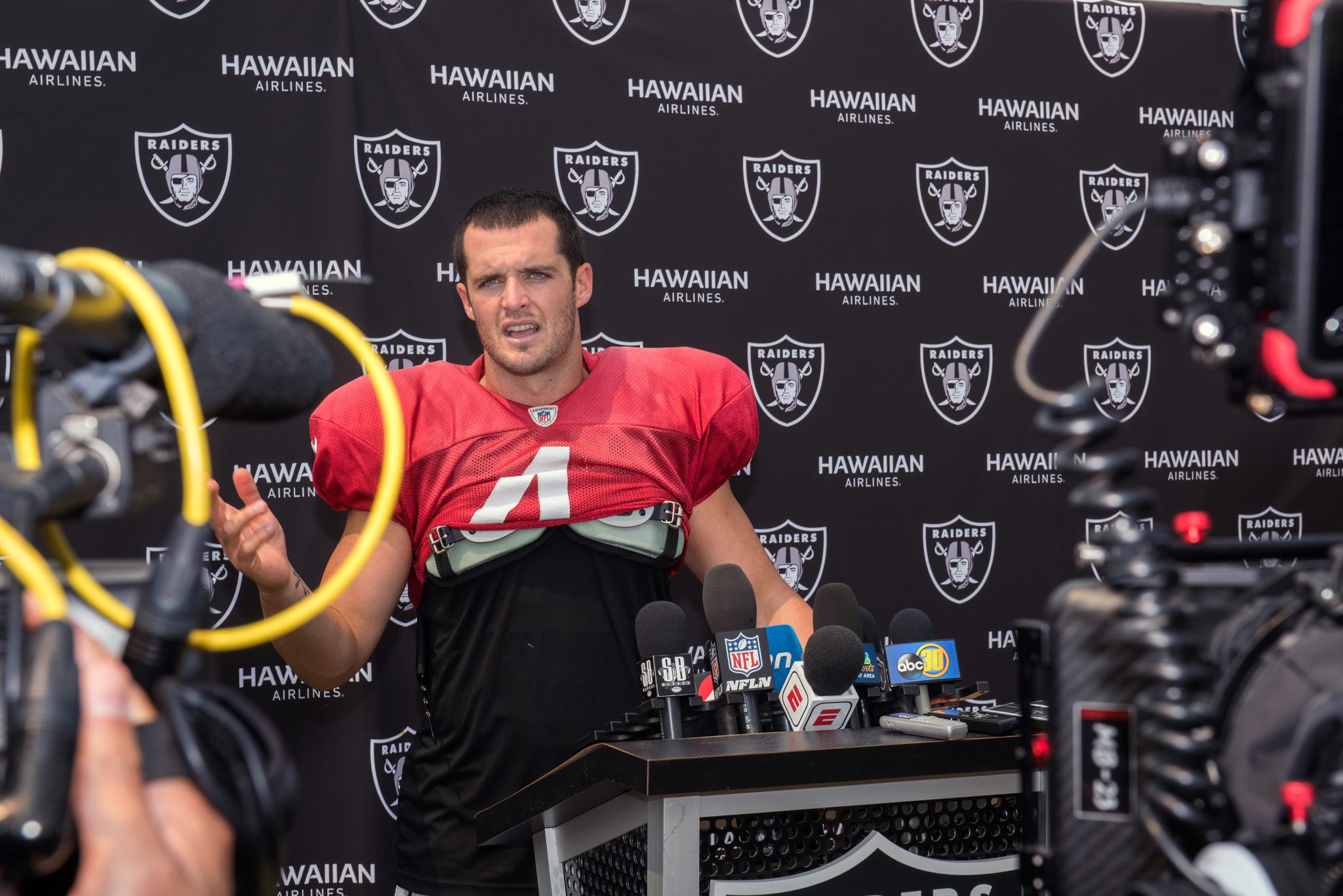 Oakland Raiders Quarterback Derek Carr speaks with the media after his practice in Napa Valley, Calif., August 7, 2018. U.S. Air Force photo by Louis Briscese via Creative Commons License.