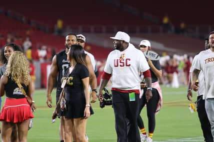 USC Trojans Co-Defensive Coordinator Eric Henderson With Aaron Donald After The USC Trojans Beat Utah State At The Coliseum. USC Recruiting